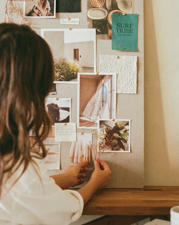 camille styles with vision board