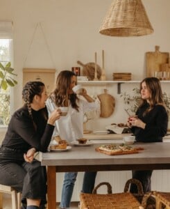 friends hanging out in kitchen, at-home cafe gathering