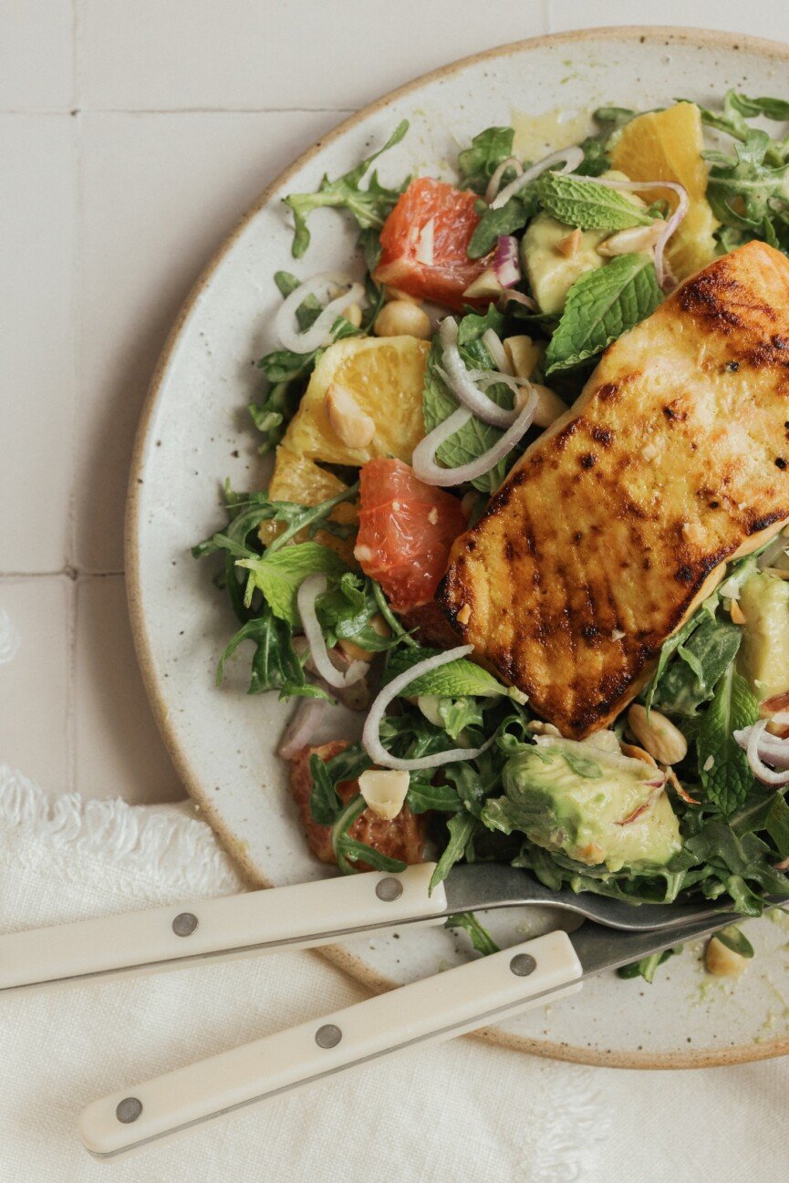 Citrus salmon salad with avocado and yellow shirt