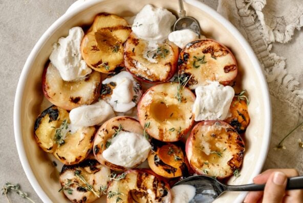 grilled peaches in bowl