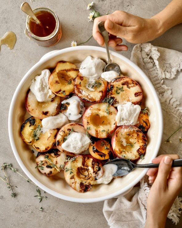grilled peaches in bowl