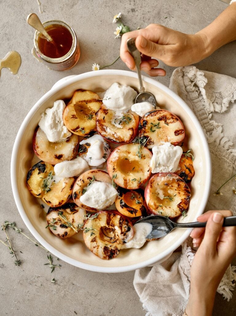 grilled peaches in bowl