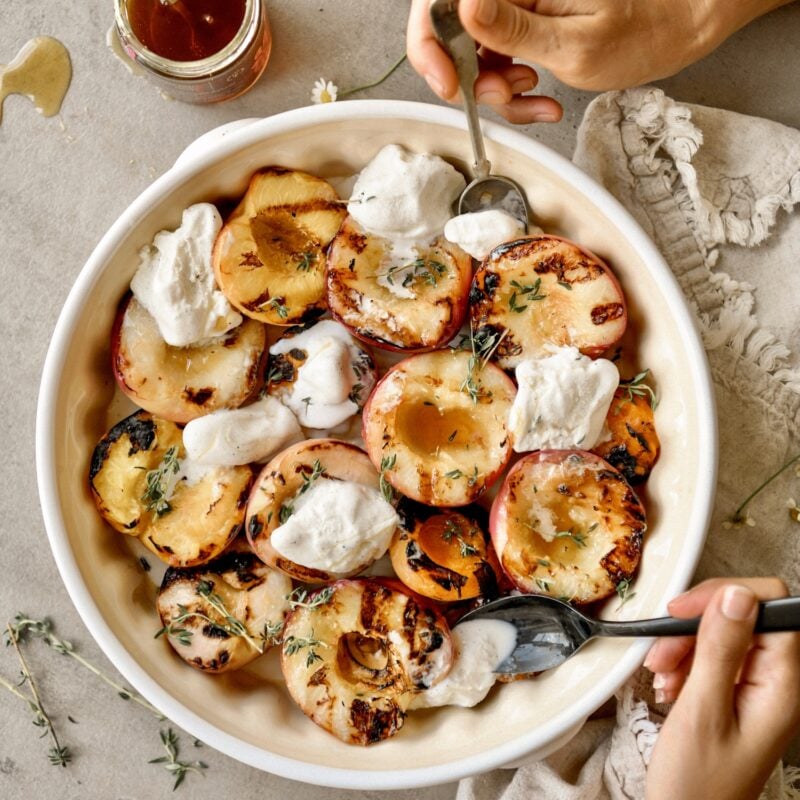 grilled peaches in bowl