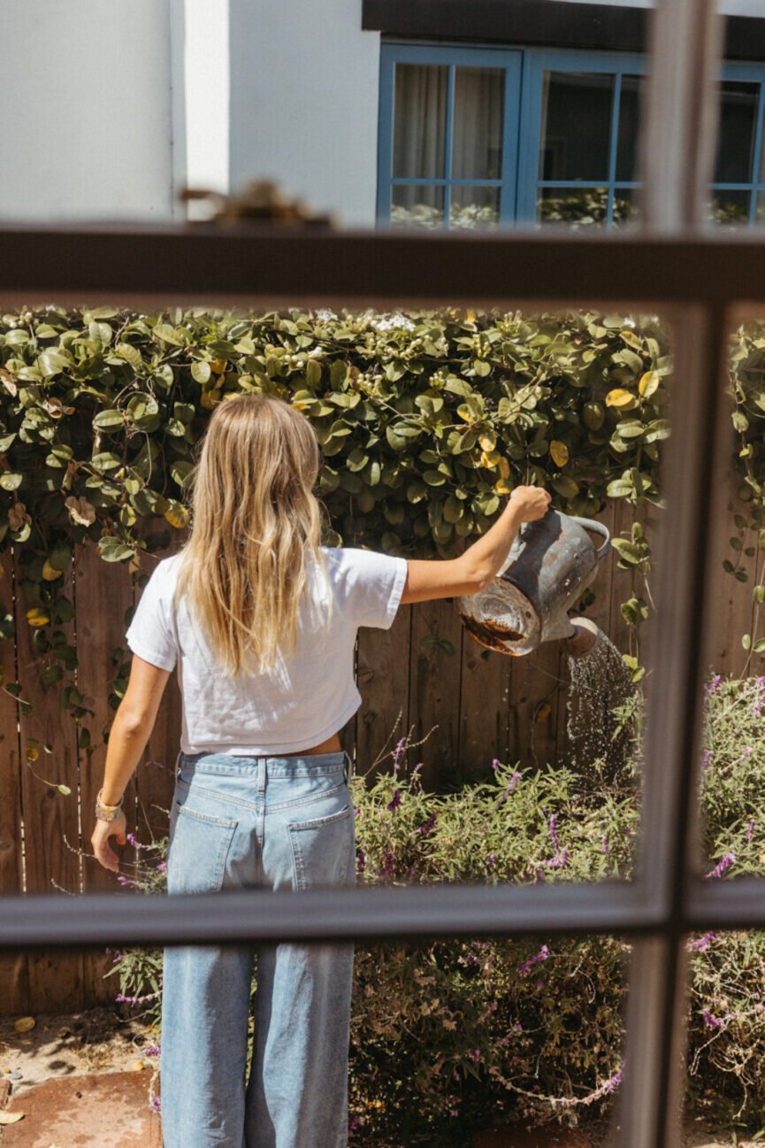 Woman gardening on a summer solo date.