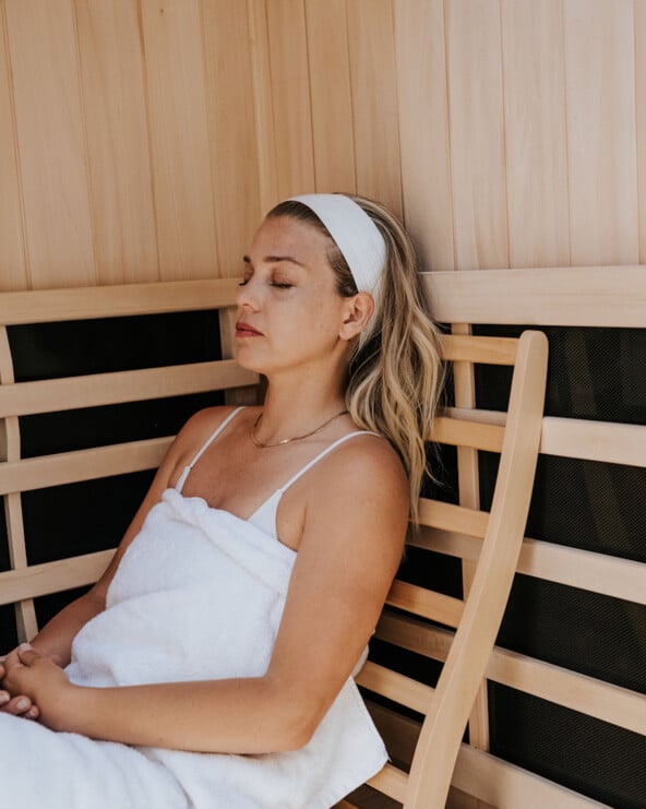 Janessa Leoné using full-body red light therapy.