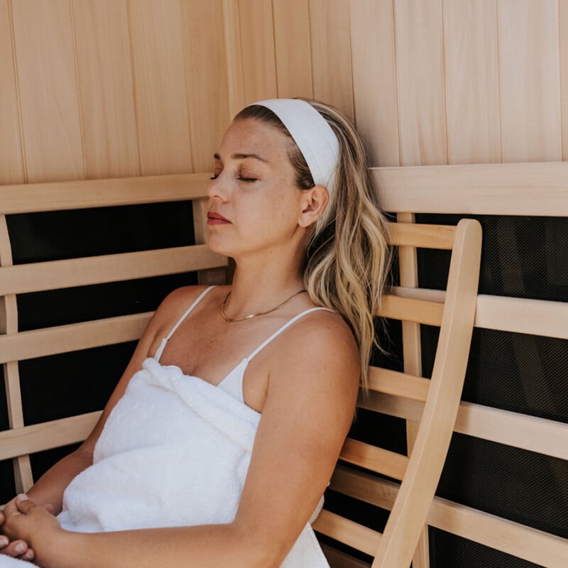 Janessa Leoné using full-body red light therapy.