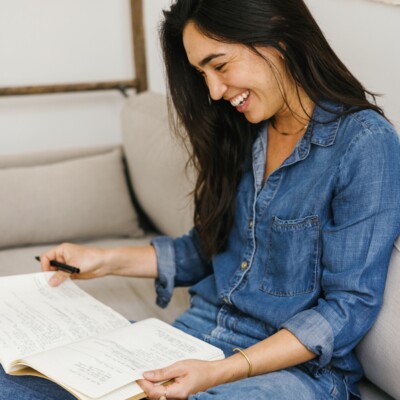 Woman writing in journal