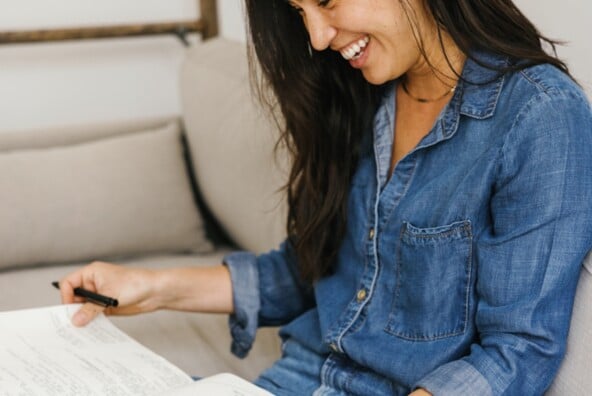 Woman writing in journal