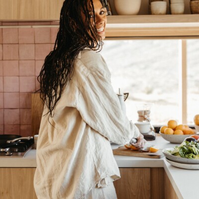 Woman cooking in kitchen_best foods for hair growth