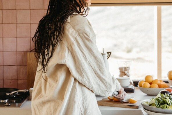 Woman cookin gin kitchen