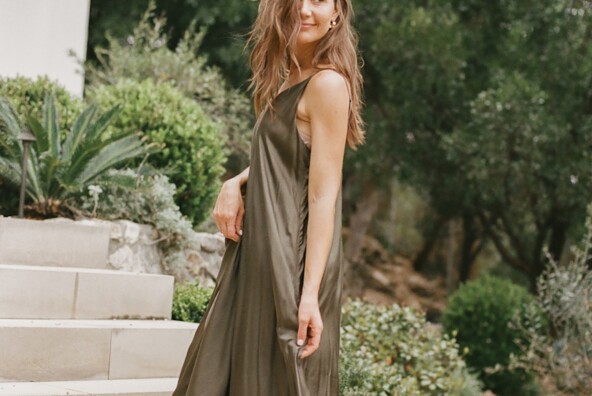Camille Styles wearing long green dress