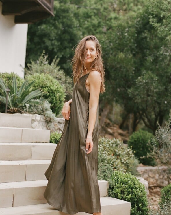 Camille Styles wearing long green dress